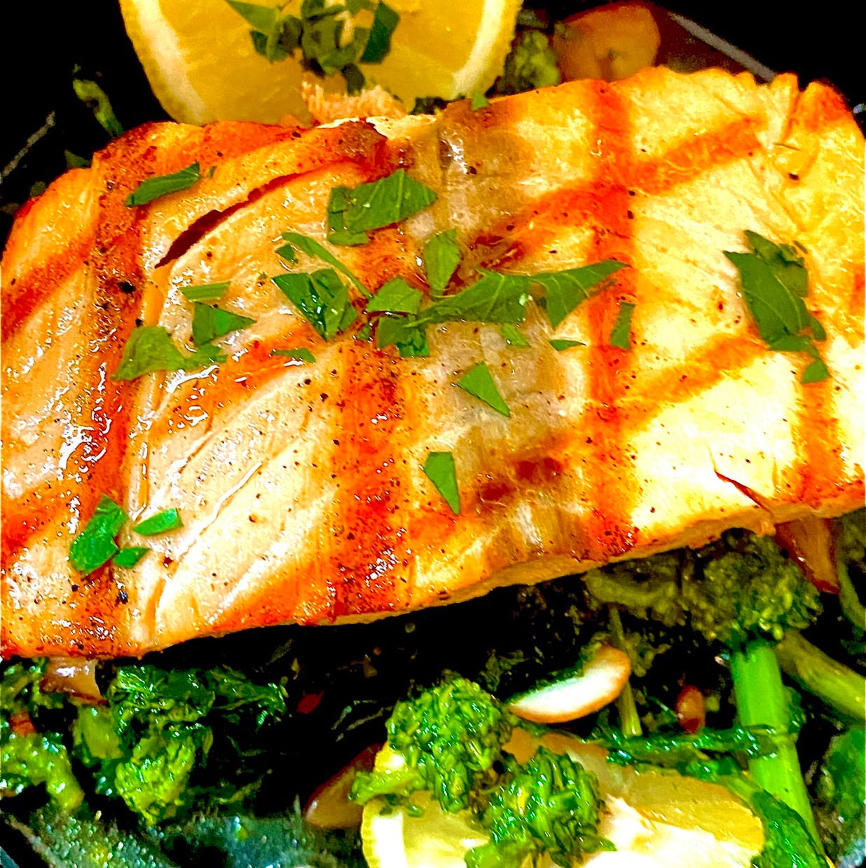 Order Grilled Salmon Rappini* - Grilled Salmon Rappini* food online from La Familia store, Katonah on bringmethat.com