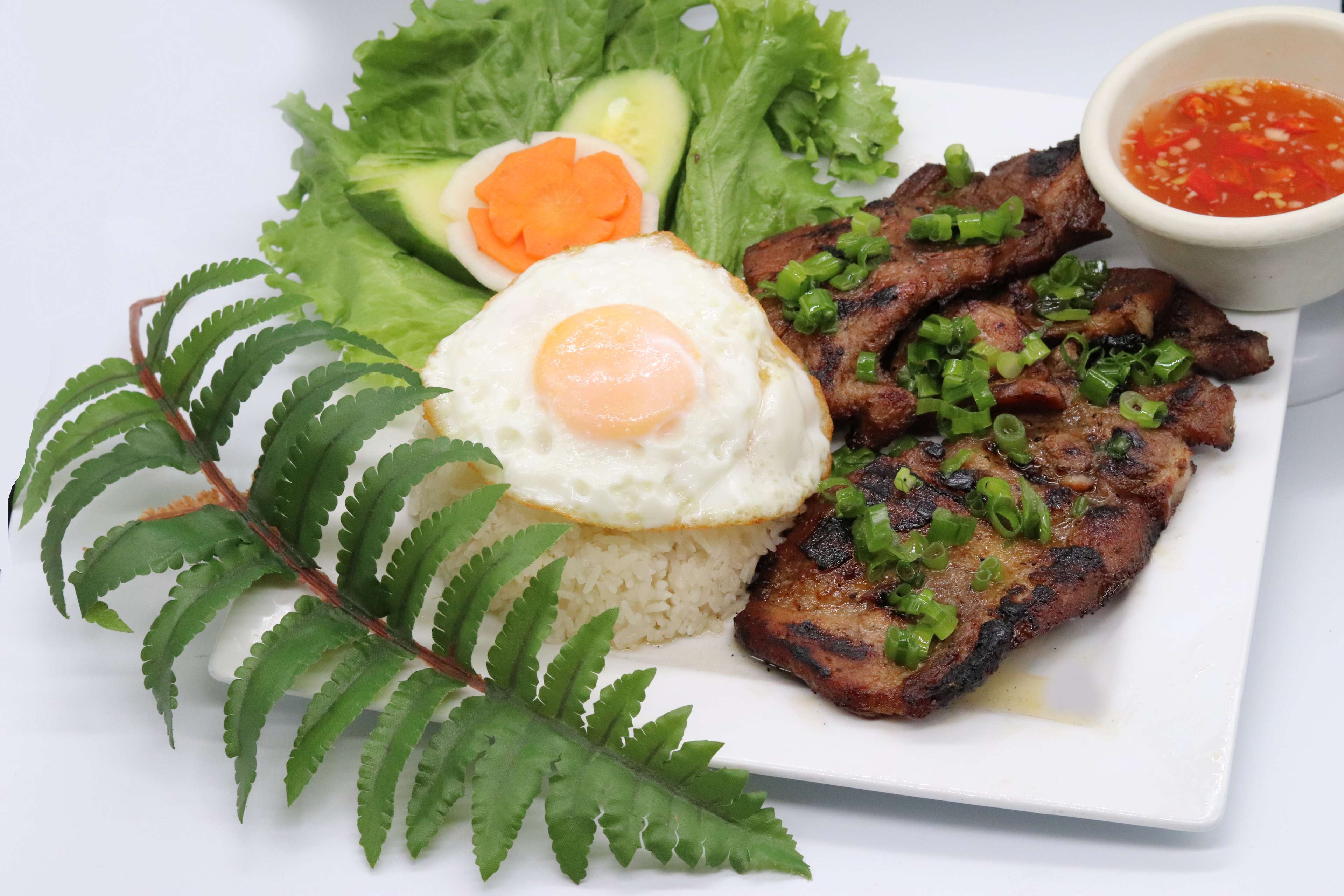 Order Grilled pork chop rice dish food online from Pho 78 Restaurant store, Westminster on bringmethat.com