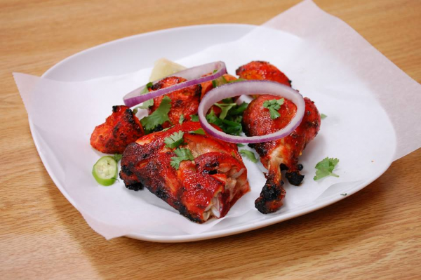 Order 2 Pieces Tandoori Chicken Leg food online from Zafran Kabab Palace store, Charlotte on bringmethat.com