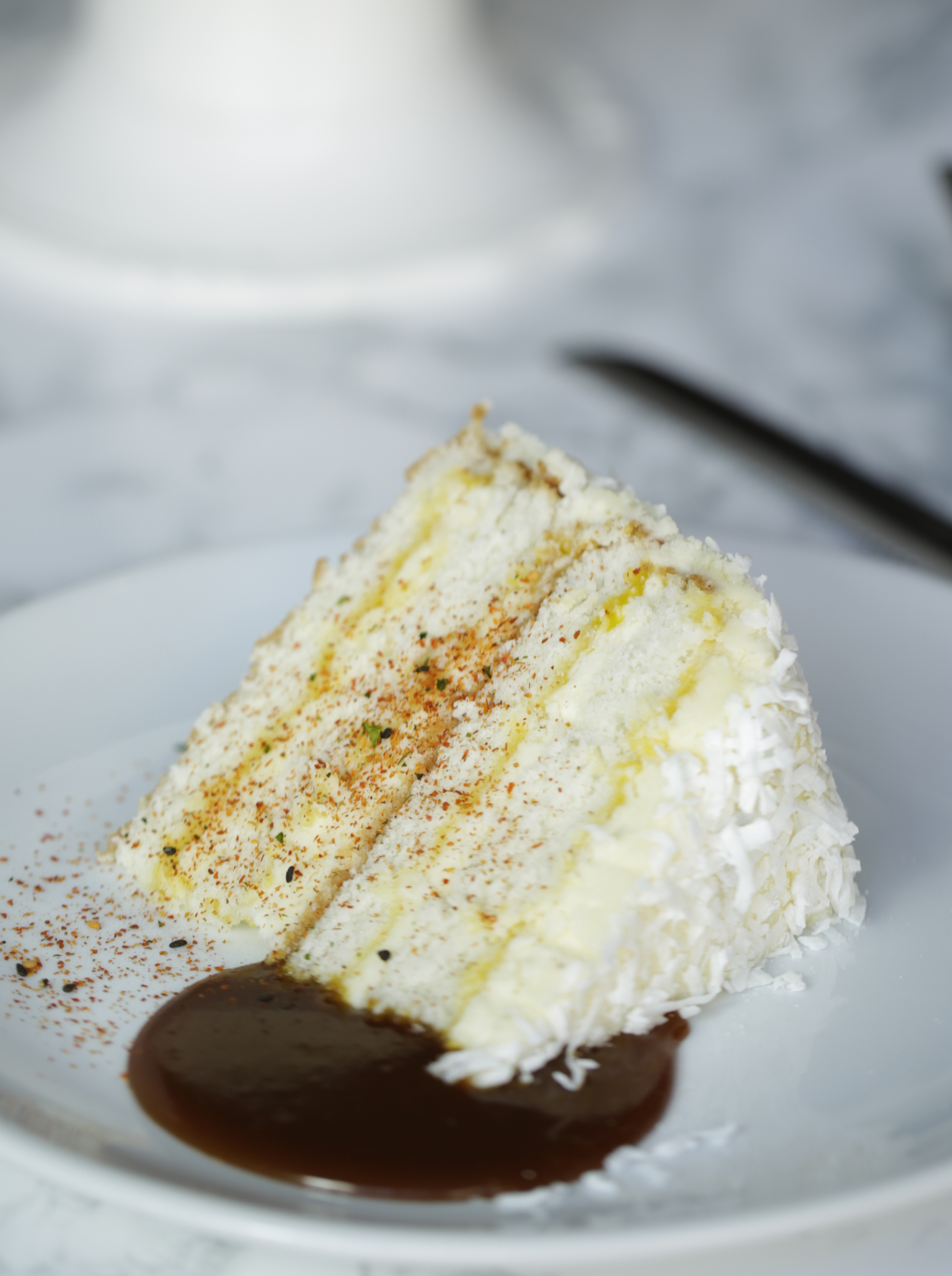 Order 4 Layer Coconut Cake food online from Community Tavern store, Chicago on bringmethat.com