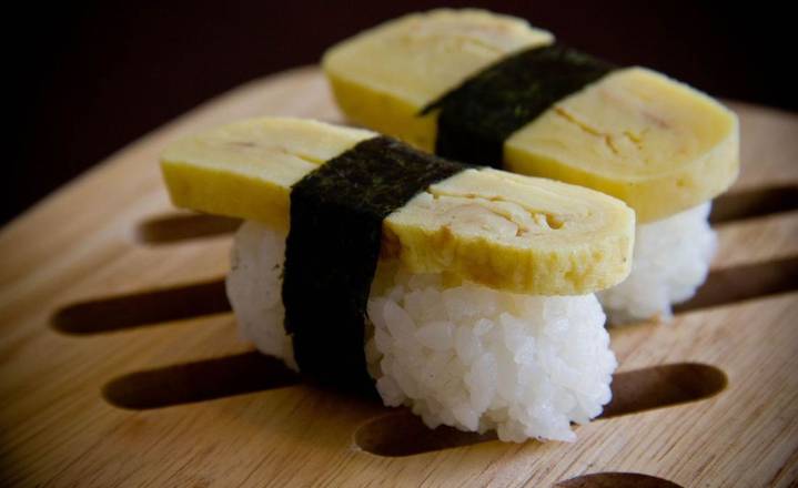 Order Tamago Nigiri food online from Sushi Uma store, San Francisco on bringmethat.com