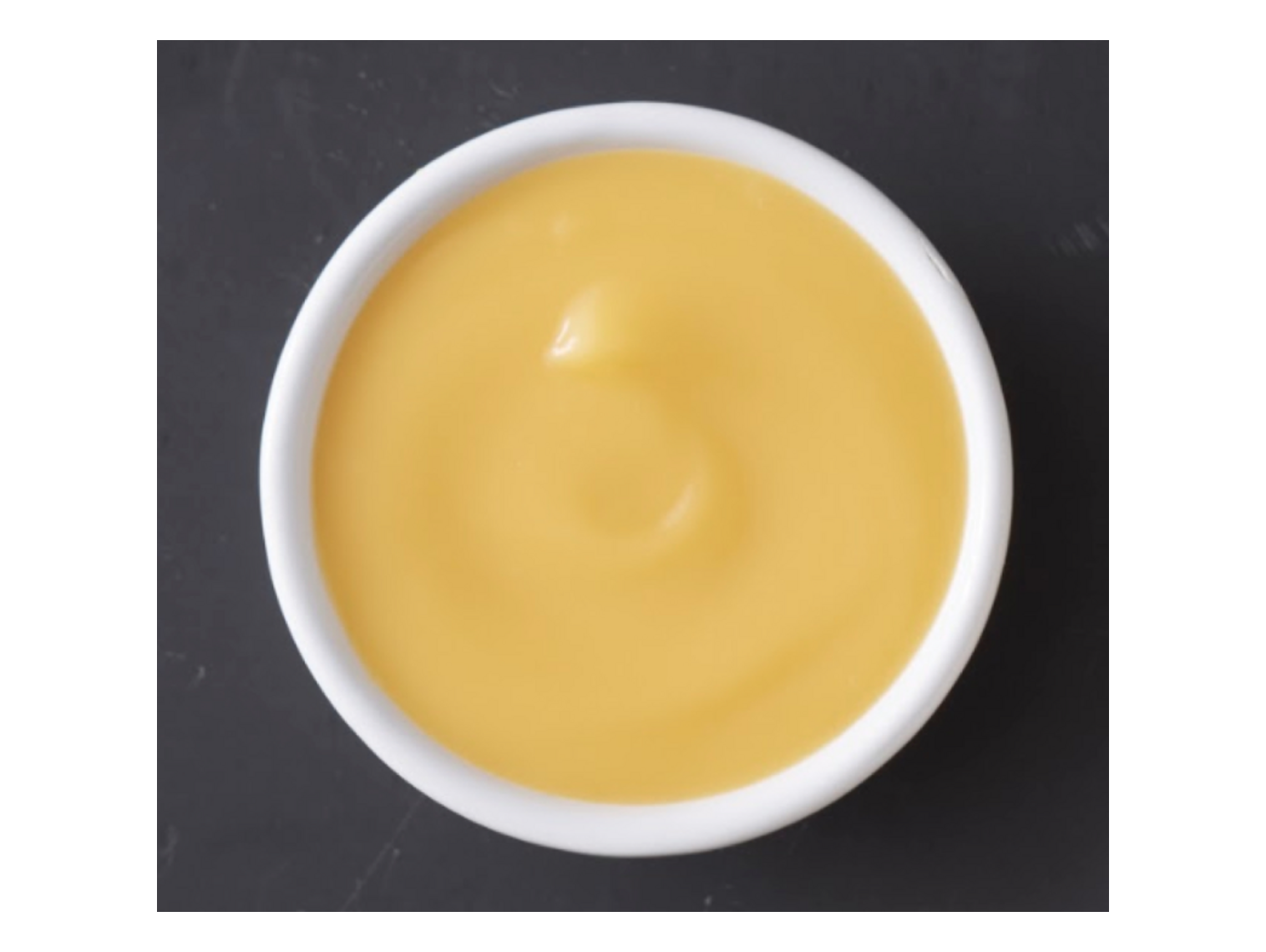 Order Cheese Sauce (2 oz) food online from Wings Over store, Greenville on bringmethat.com