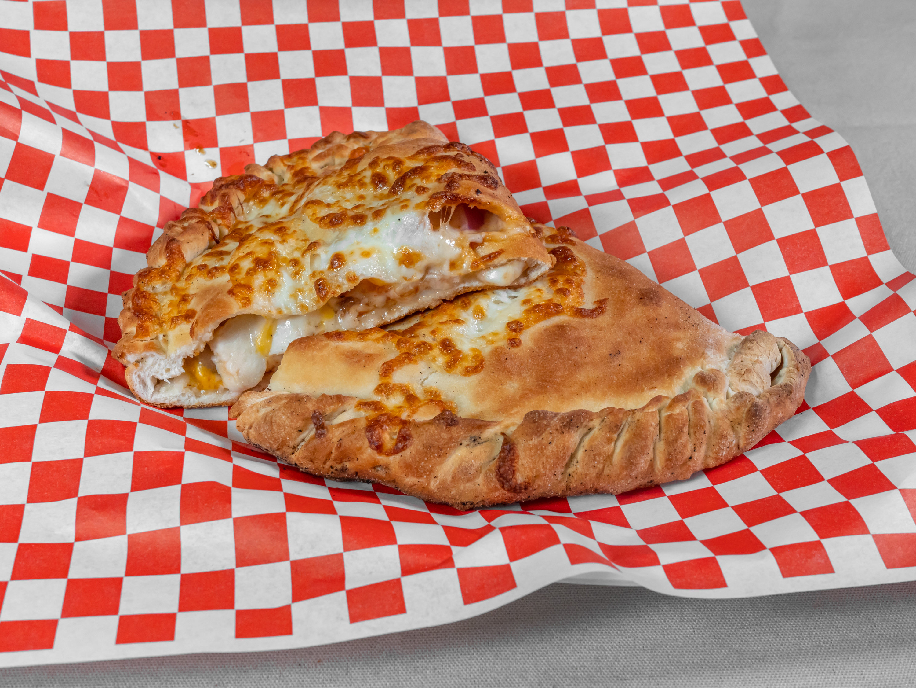 Order Garlic Chicken Calzone food online from Epic Pizza store, Modesto on bringmethat.com