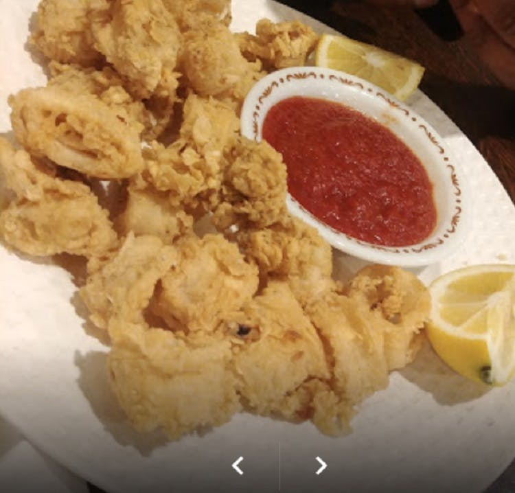 Order Fried Calamari - Appetizer food online from Delia's Pizzeria & Grill store, Springfield on bringmethat.com