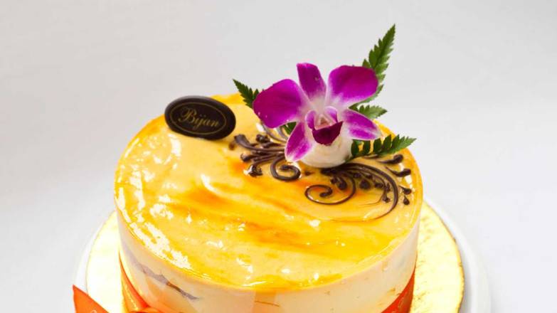 Order 8" Mango Mousse cake food online from Bijan Bakery & Cafe store, San Jose on bringmethat.com