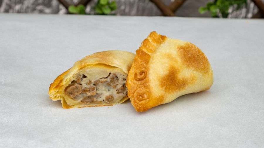 Order Biscuits and Gravy with Sausage food online from World Empanadas store, Burbank on bringmethat.com