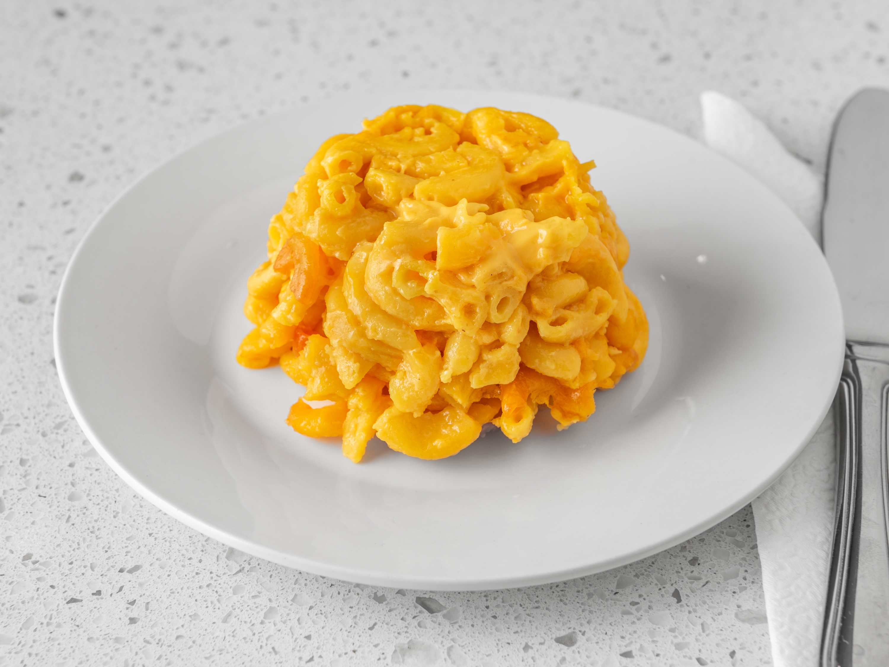 Order Mac & Cheese food online from Aunty Joy's Jamaican Kitchen store, Chicago on bringmethat.com