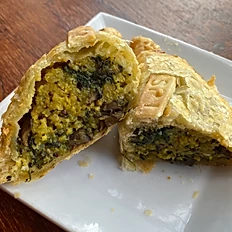 Order Spinach and mushrooms empanada food online from Bombole store, Tucson on bringmethat.com