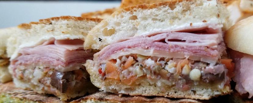 Order Muffaletta Sangweech food online from Tables For Two Llc store, New Providence on bringmethat.com