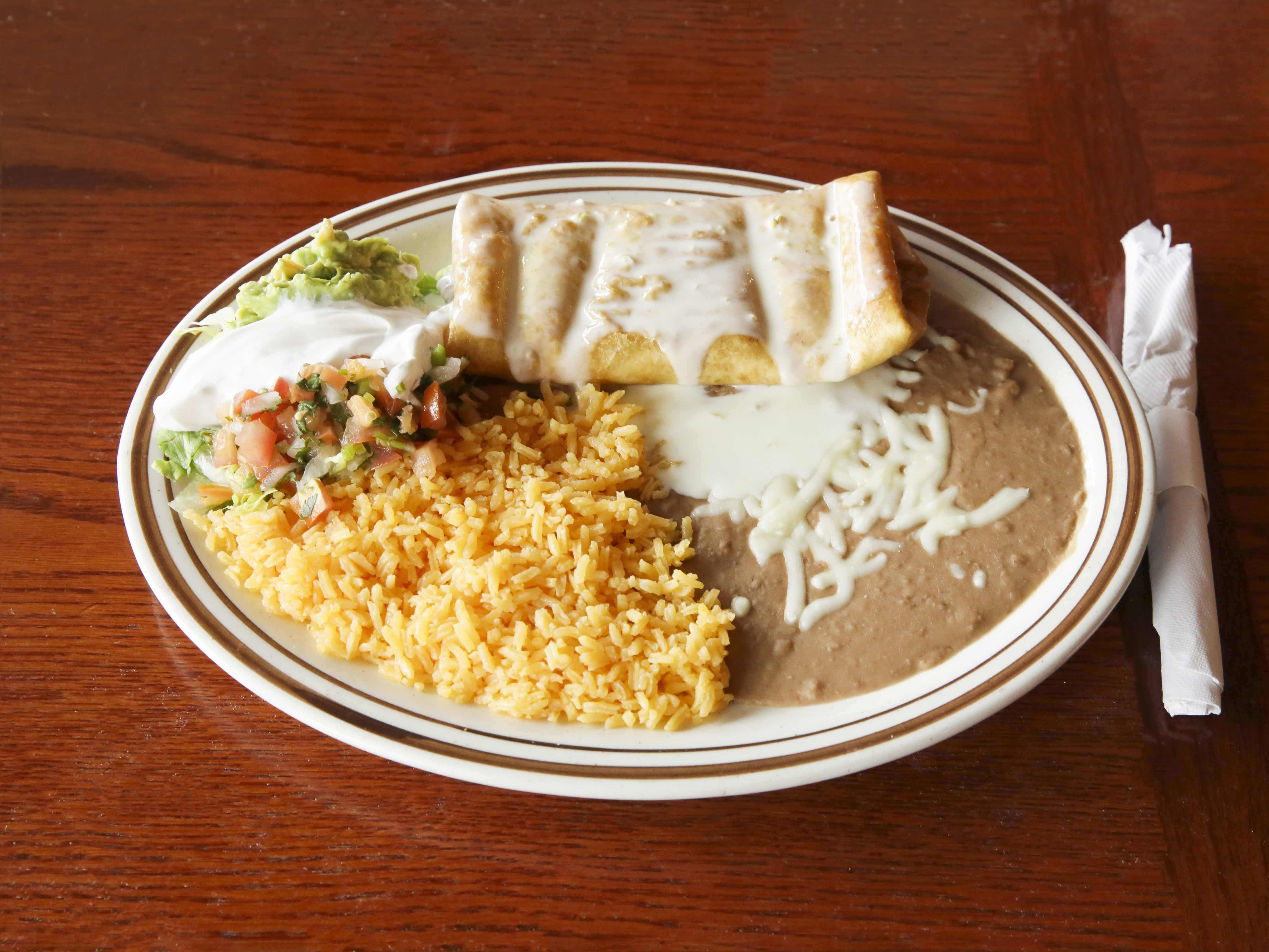 Order Chimichanga food online from Pastorcito Mexican Restaurant store, Green Bay on bringmethat.com