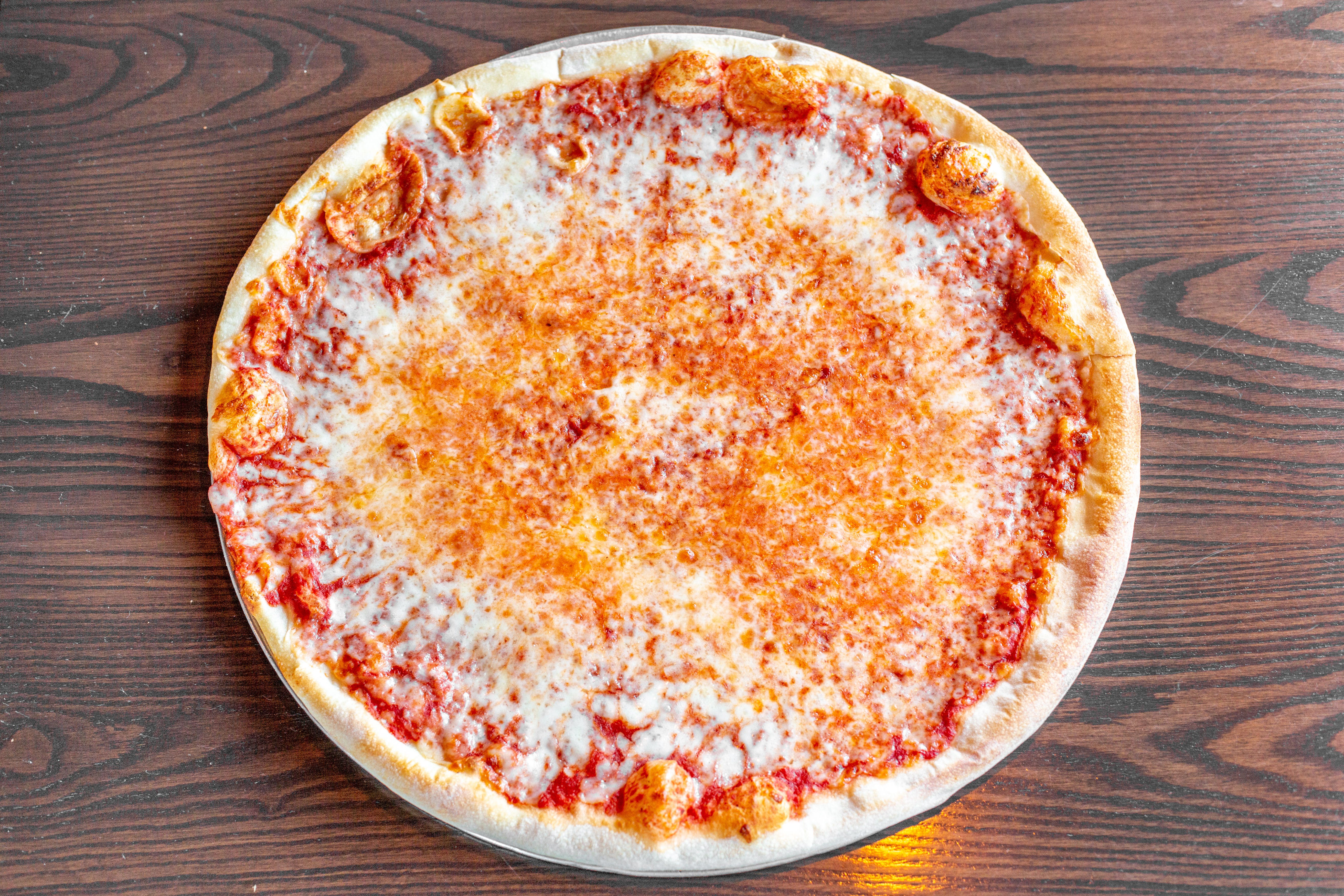 Order Neapolitan Cheese Pizza - Large food online from King of Pizza store, Berlin on bringmethat.com