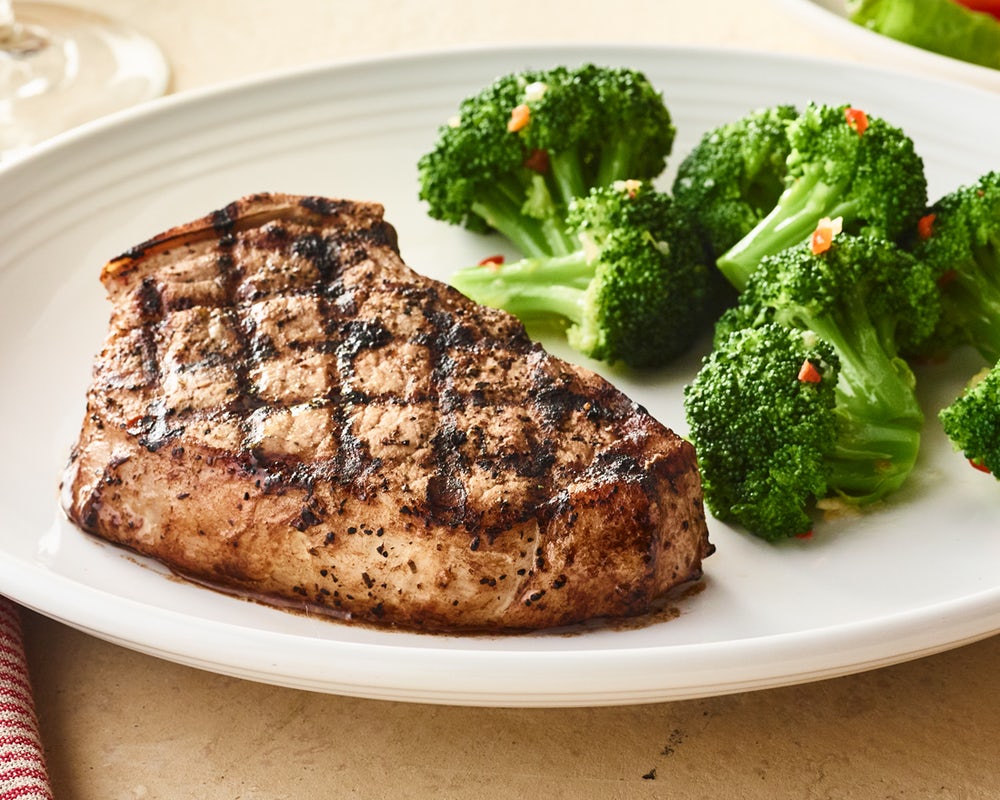 Order Tuscan-Grilled Pork Chop* - One Chop	 food online from Carrabba Italian Grill store, Fayetteville on bringmethat.com