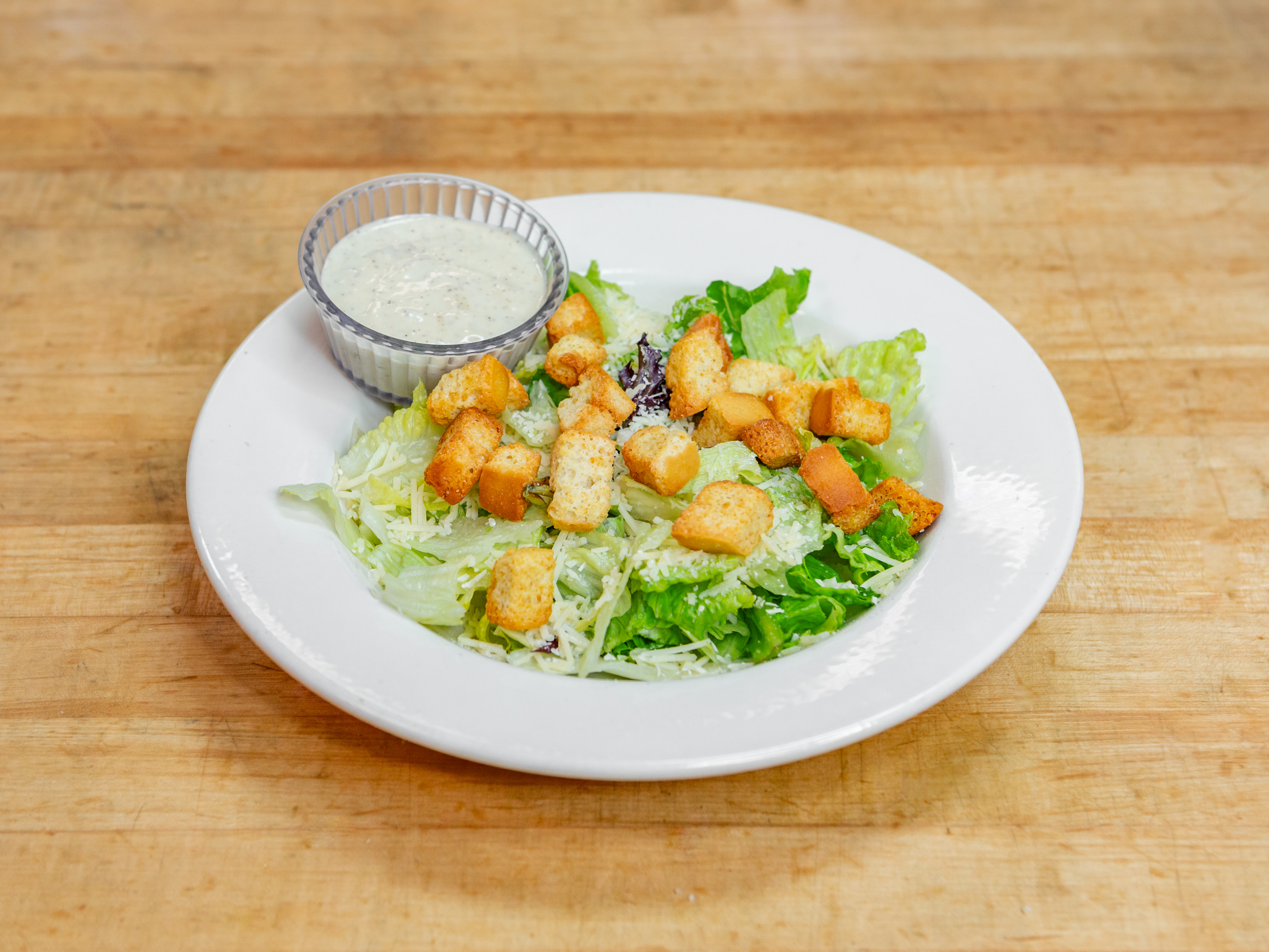 Order Caesar Salad food online from Guidos Pizza store, Anchorage on bringmethat.com