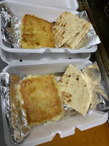 Order Saganaki "Opa" (330 cal) food online from Leo Coney Island store, Shelby Charter Township on bringmethat.com