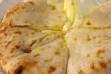Order Cheese Naan food online from The Royal Indian Cuisine store, Philadelphia on bringmethat.com