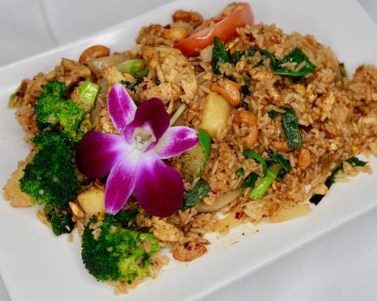 Order Pineapple Fried Rice* food online from Orchid Thai Restaurant & Bar store, Sacramento on bringmethat.com
