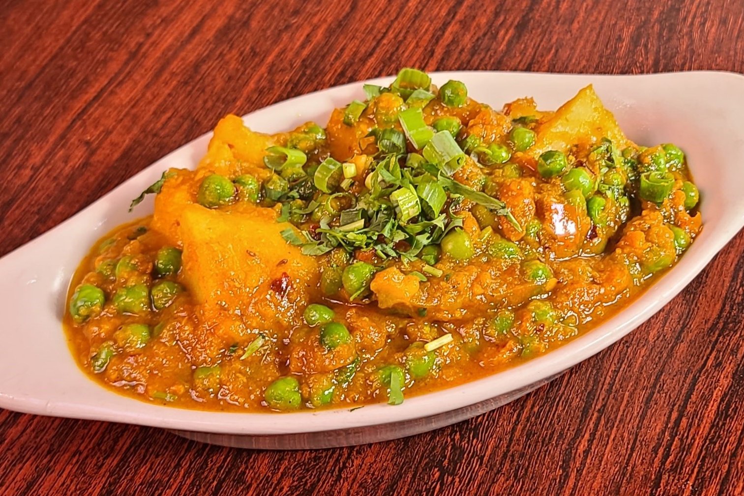 Order Aloo Matar food online from Royal Indian Cuisine store, San Francisco on bringmethat.com