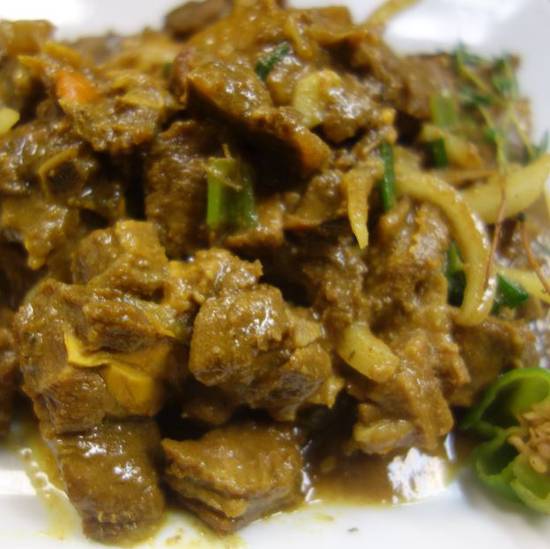 Order Curry Goat food online from Ocean Blue Caribbean Restaurant and Bar store, Chandler on bringmethat.com