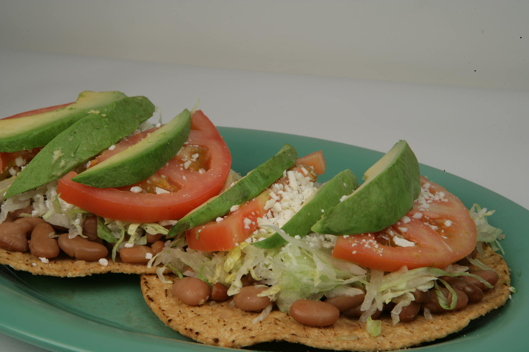 Order Tostadas de Aguacate /Each food online from Rodeo Mexican Grill store, Los Angeles on bringmethat.com