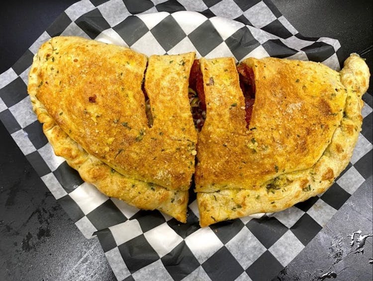 Order Calzone - Calzones food online from Classic Pizza store, Central Lake on bringmethat.com