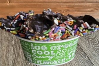 Order Chocolate with Rainbow Sprinkles Dipped Waffle Bowl food online from Ben & Jerry's store, Plano on bringmethat.com