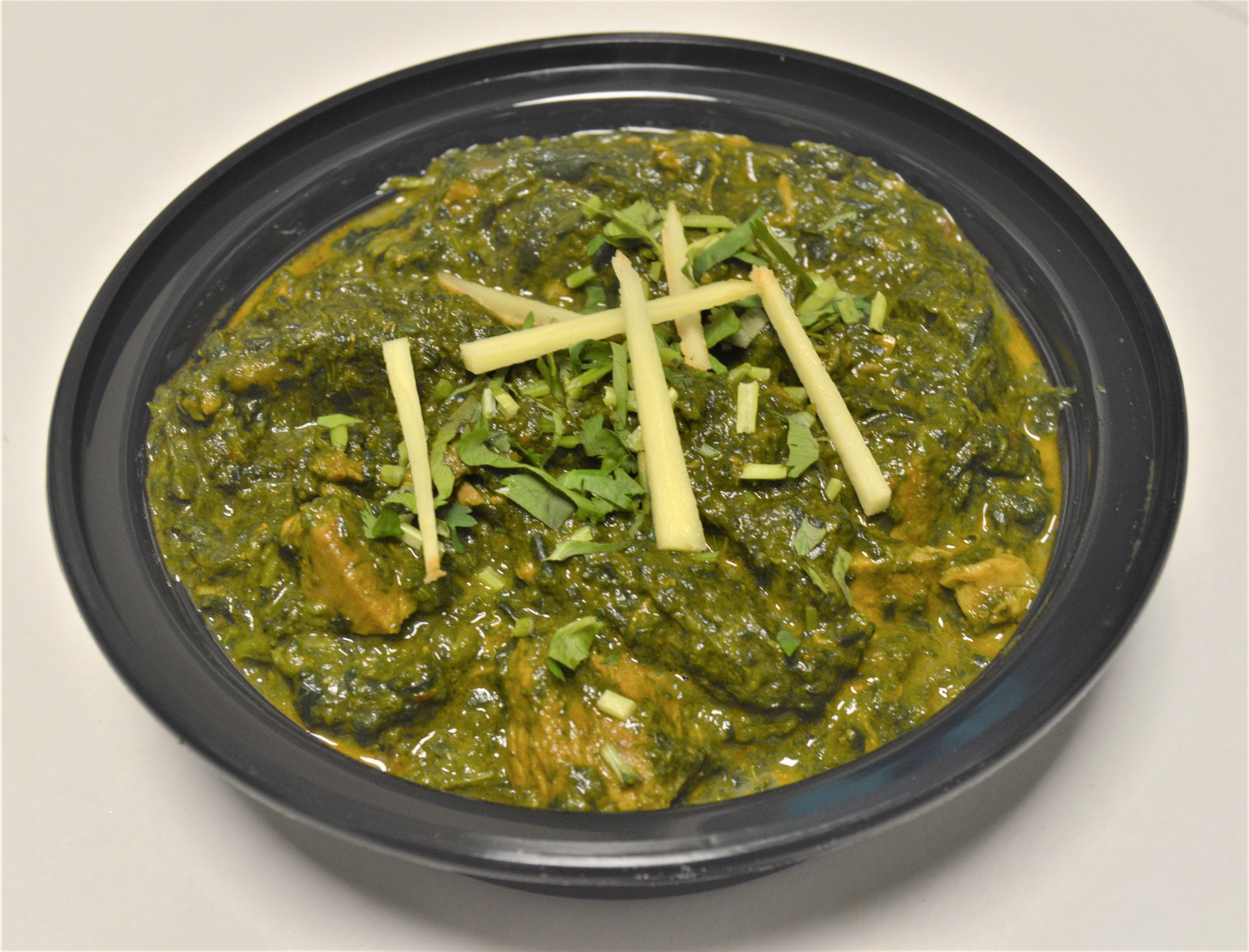 Order 33. Lamb Saag food online from Salt And Pepper Grill Iii store, Washington on bringmethat.com