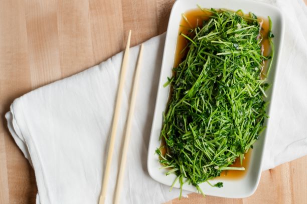 Order pea sprouts with garlic food online from Dan Modern Chinese store, Playa Vista on bringmethat.com