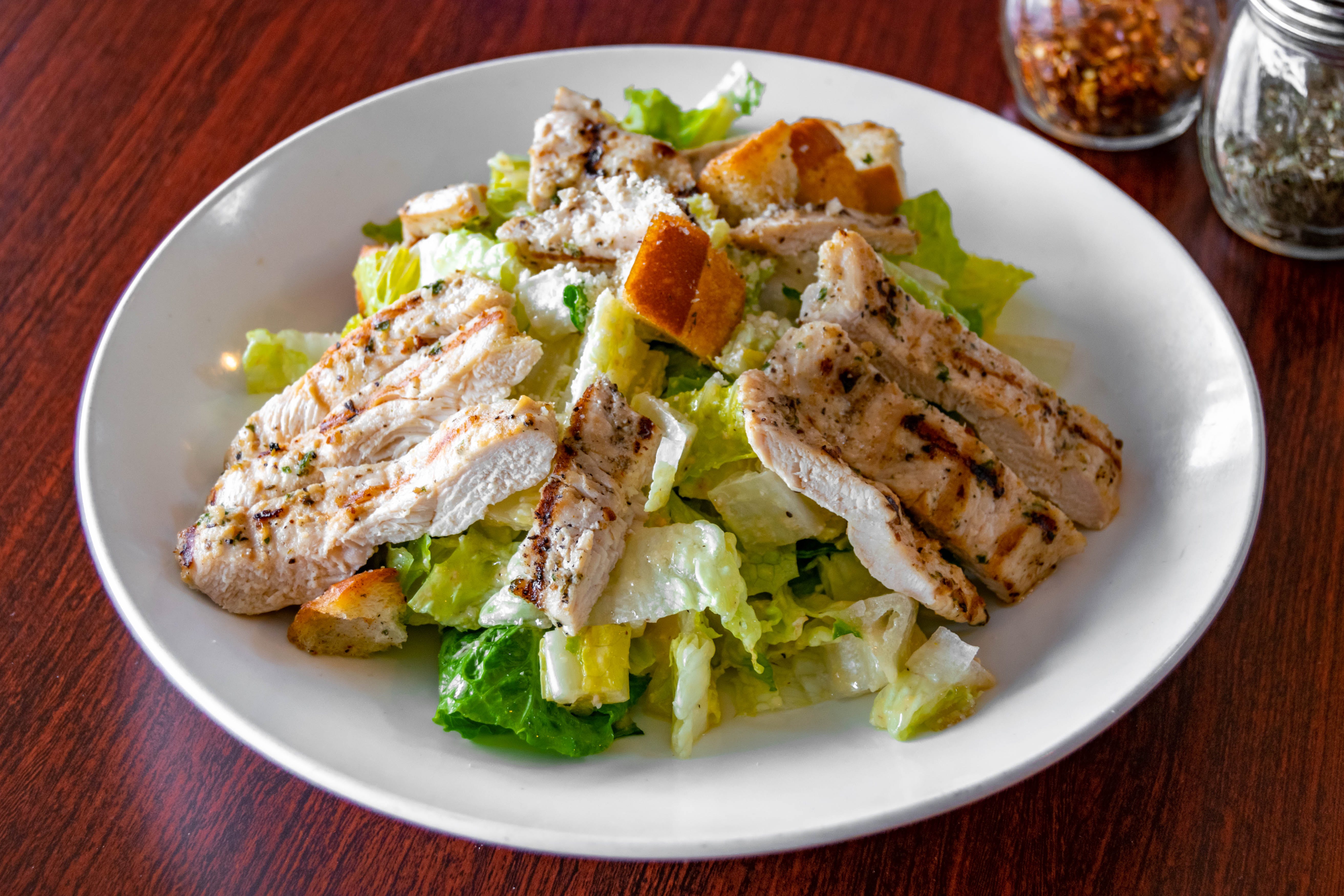 Order Grilled Chicken Caesar Salad - Salads food online from Mondo Pizza store, Randolph on bringmethat.com