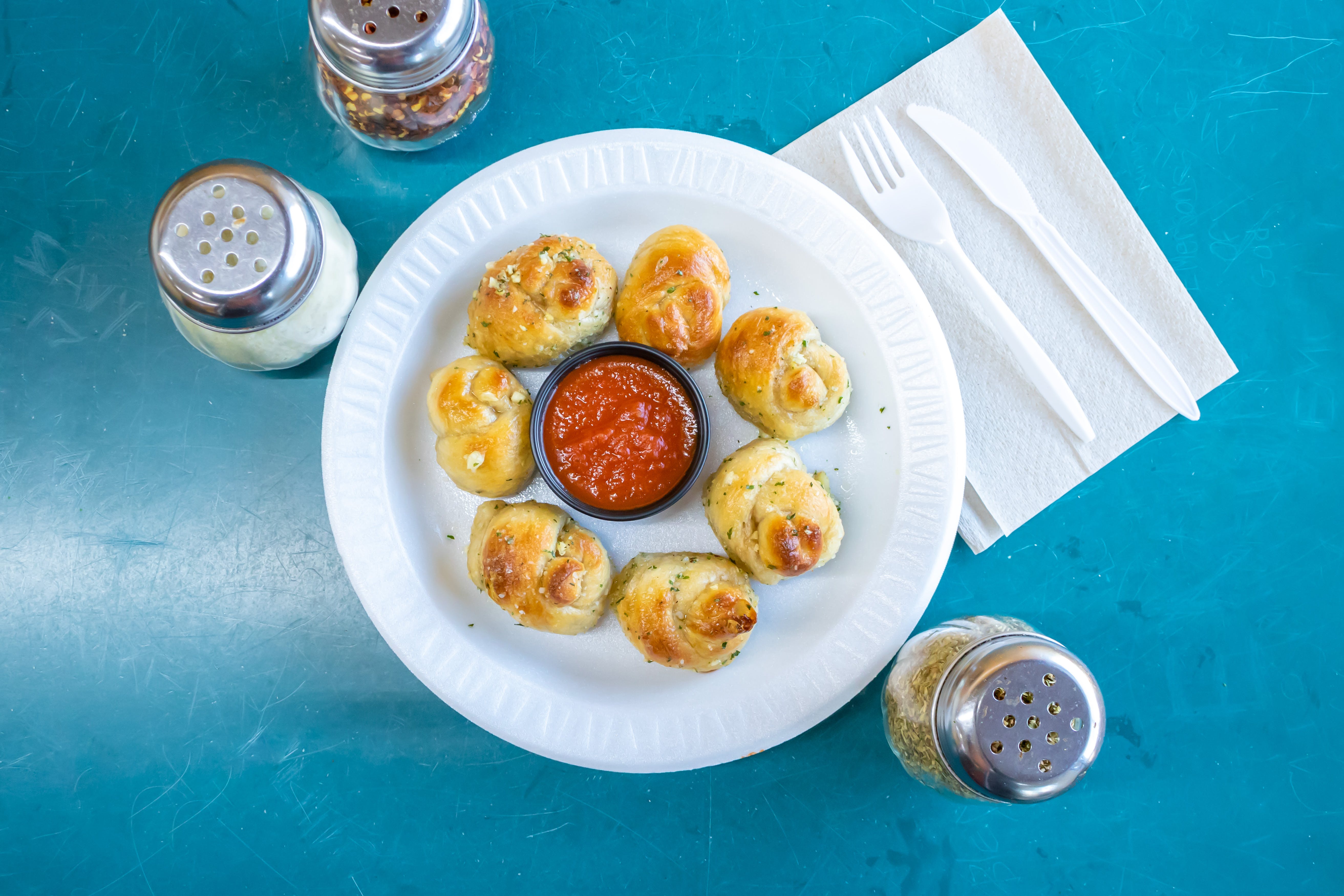 Order Garlic Knots - 6 Pieces food online from T J's Pizza & Pasta store, Lawrence on bringmethat.com