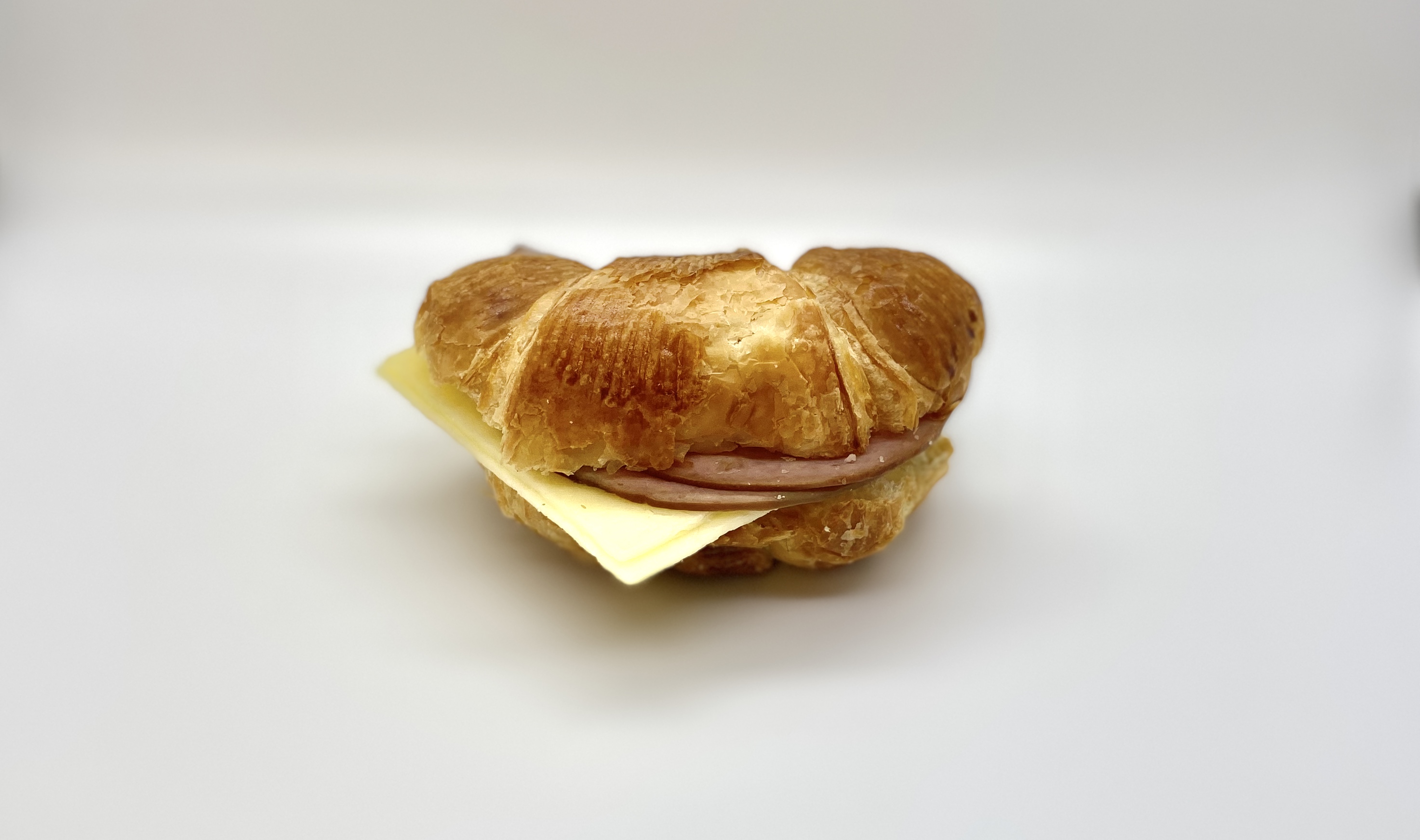 Order Ham & Cheese Croissant  food online from Blue Donkey Coffee Co. store, Atlanta on bringmethat.com