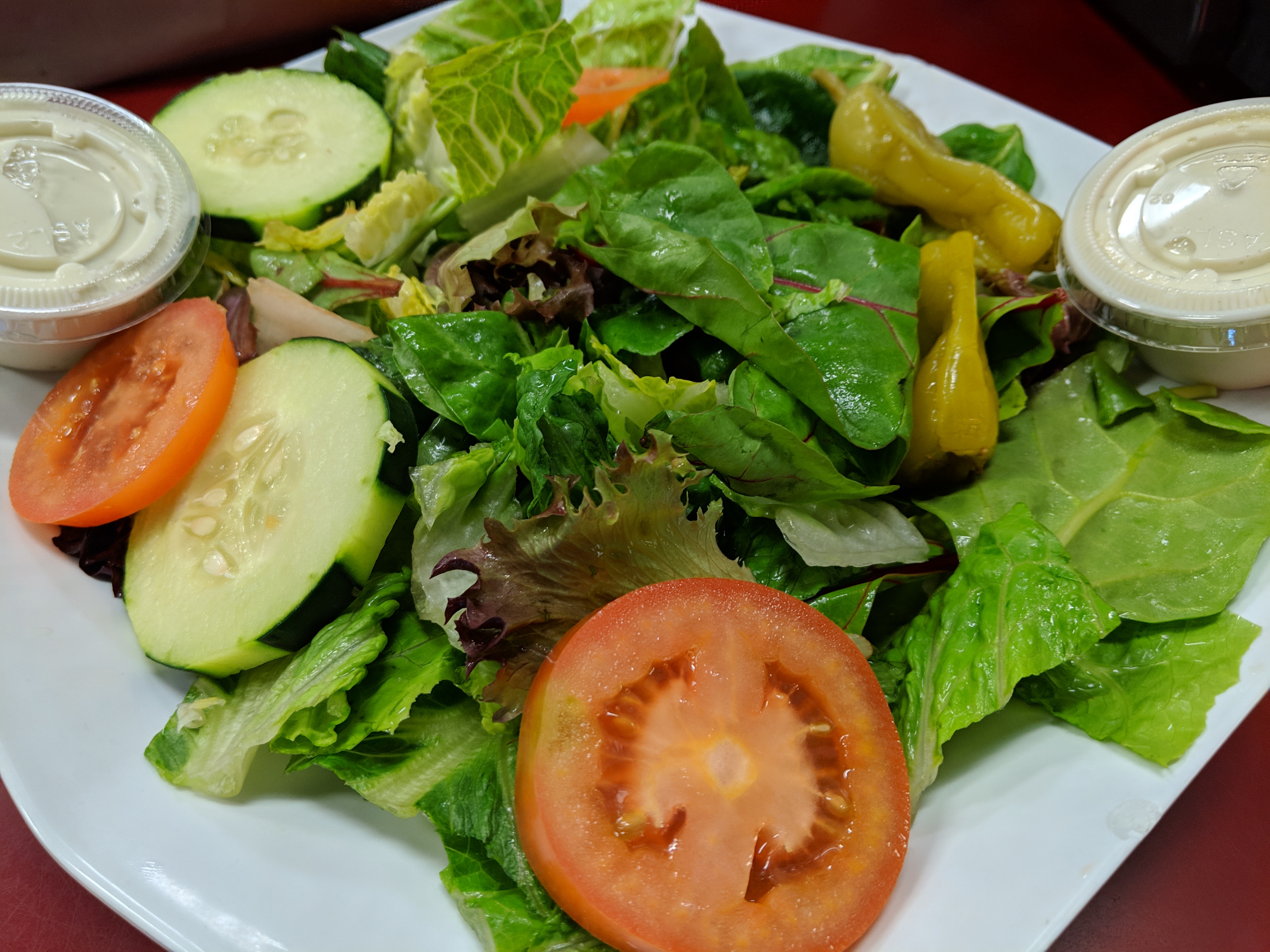 Order Garden Salad food online from Deli News Pizza store, Long Beach on bringmethat.com