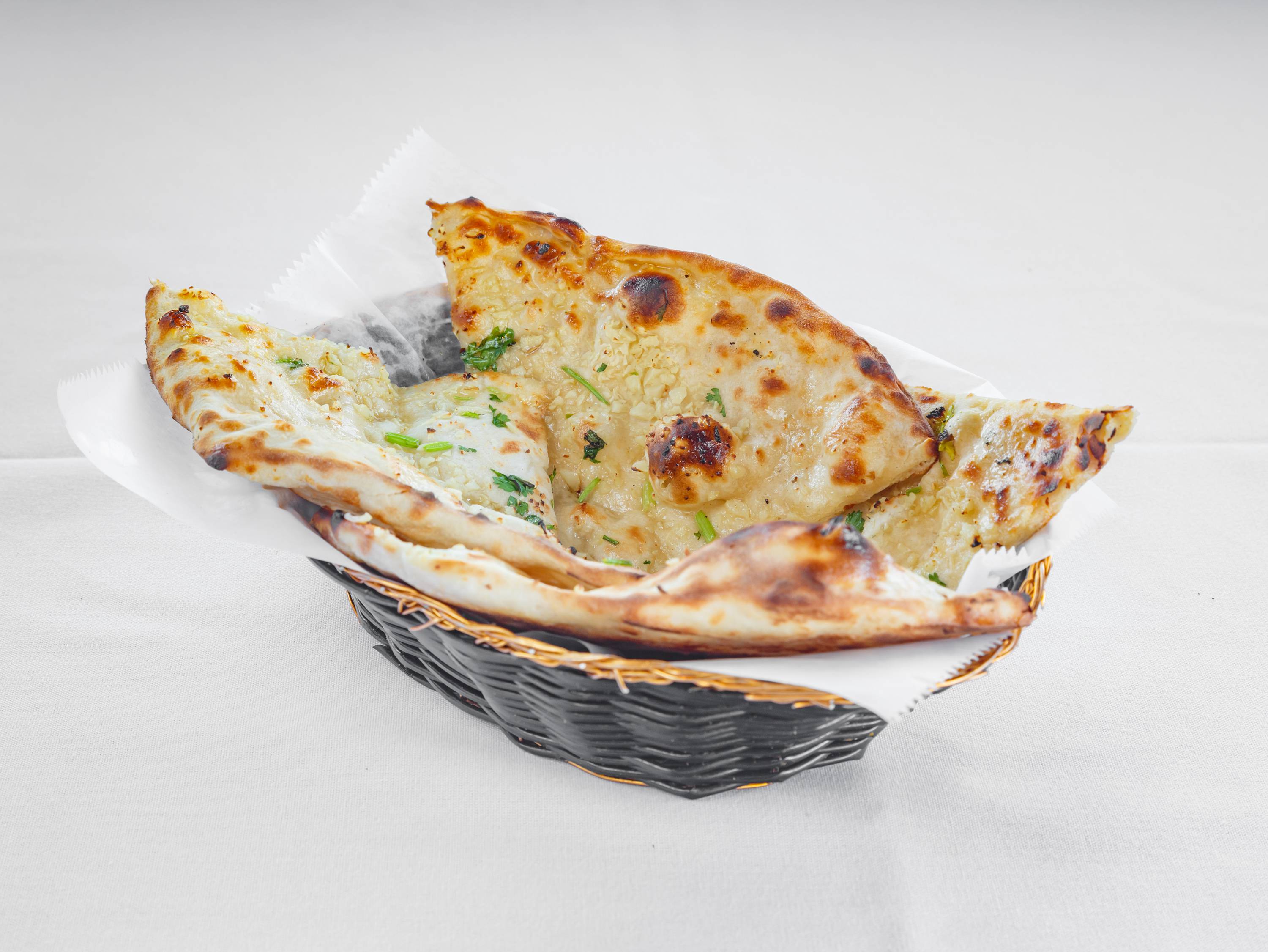 Order Garlic Naan food online from Nanking Asian Fusion Indo Chinese Restaurant store, Franklin on bringmethat.com