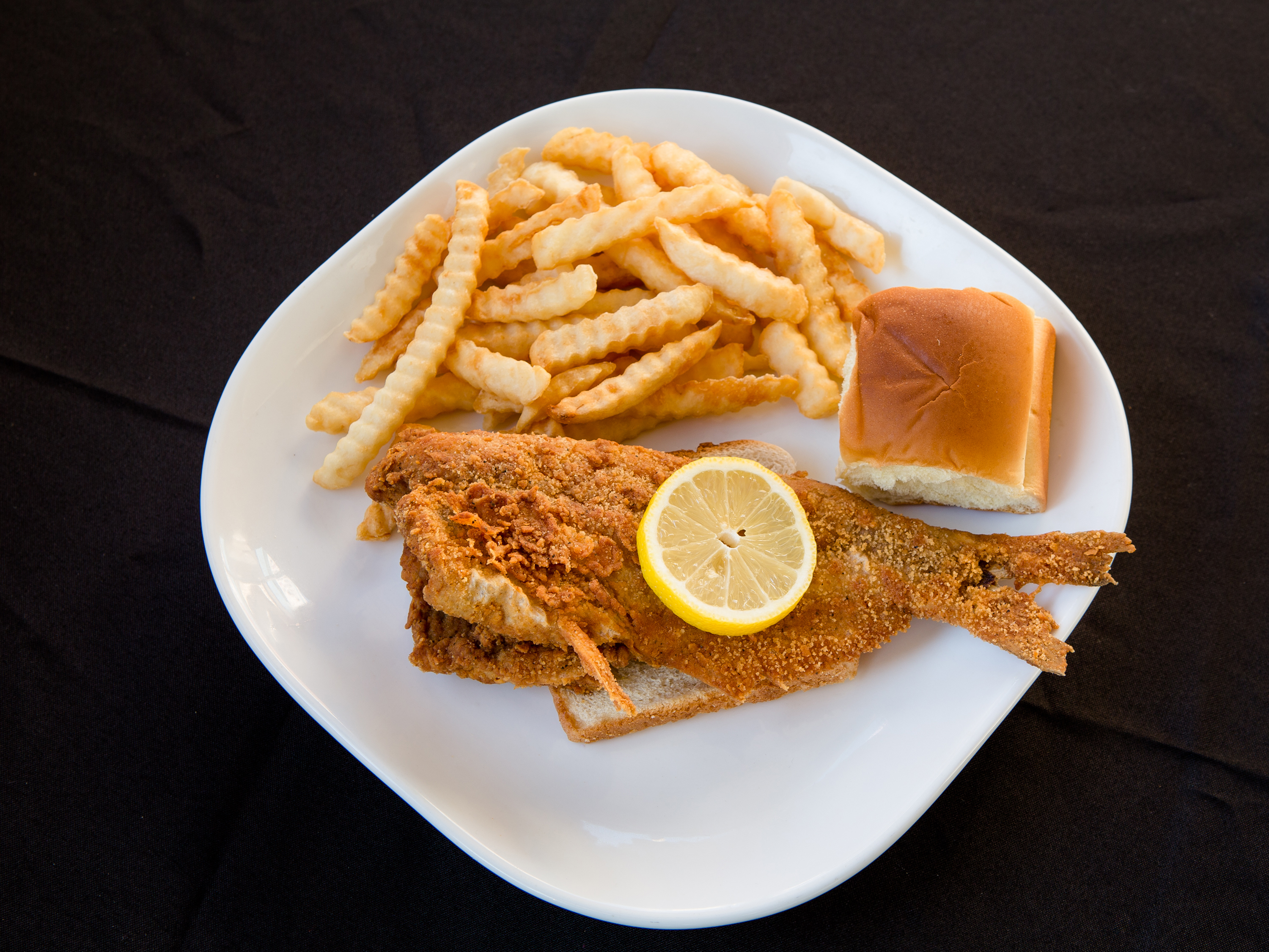 Order 1 lb. Catfish food online from Hilltop Grill store, Creve Coeur on bringmethat.com
