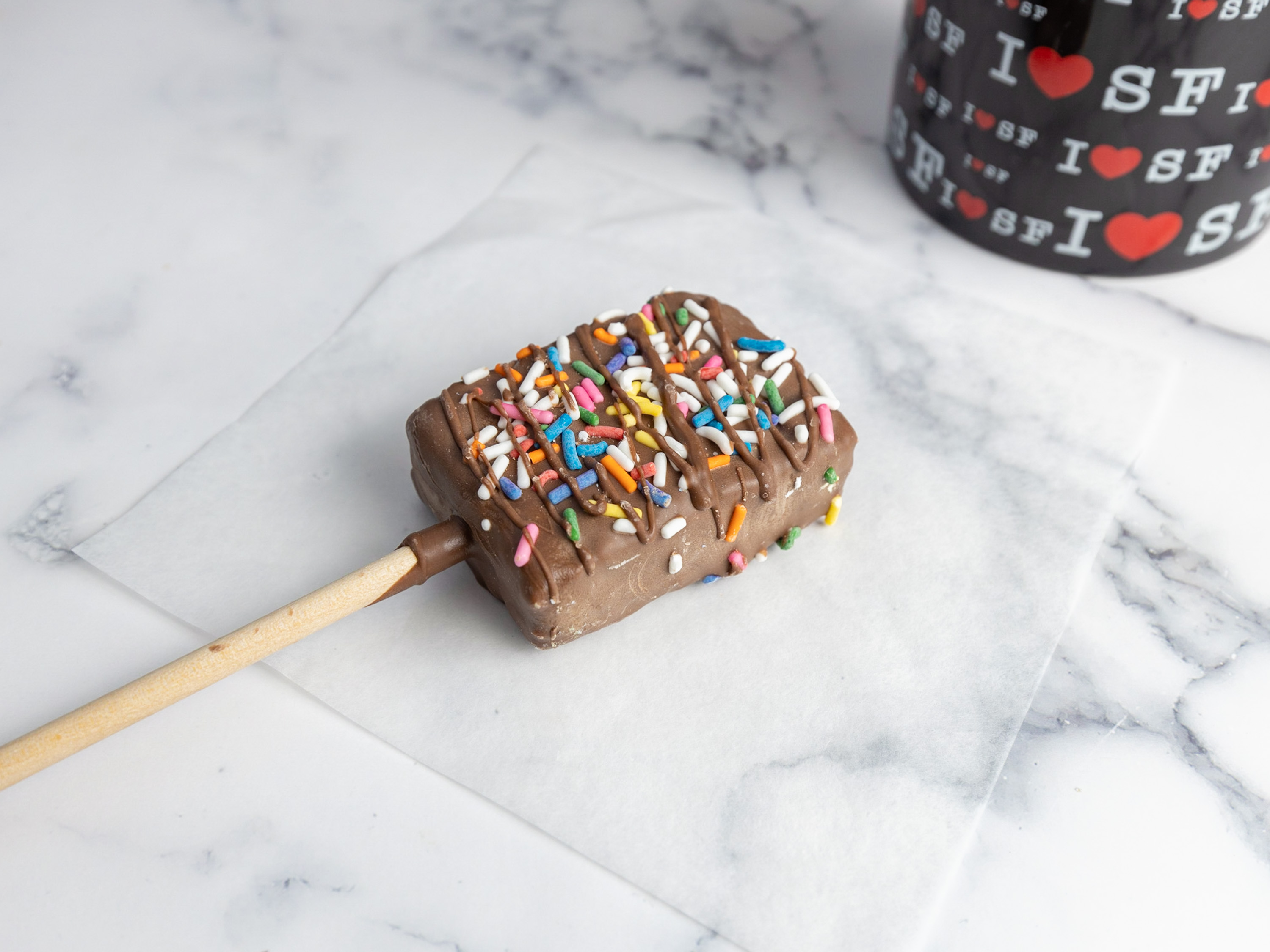 Order Chocolate Dipped Rice Krispy Treat on a Stick with Sprinkles food online from San Francisco Chocolate Store store, San Francisco on bringmethat.com