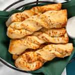 Order Garlic Parmesan Twists (6 Pieces) food online from Round Table Pizza - San Leandro store, San Leandro on bringmethat.com