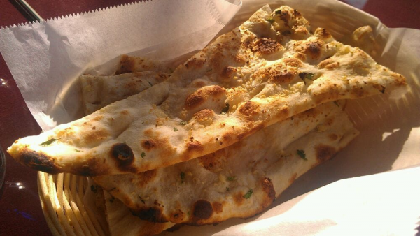Order Garlic Naan food online from Himalayan cafe store, San Dimas on bringmethat.com