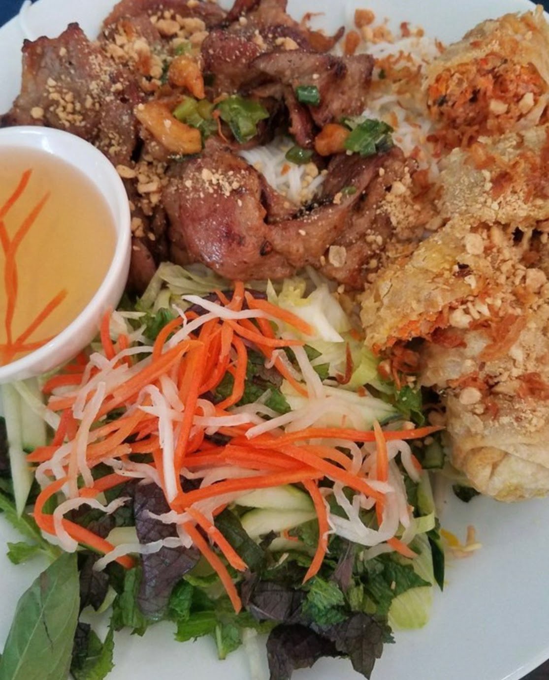 Order B1. Grilled Pork and Egg Rolls Bun food online from Pho Hong Chau store, Salt Lake City on bringmethat.com