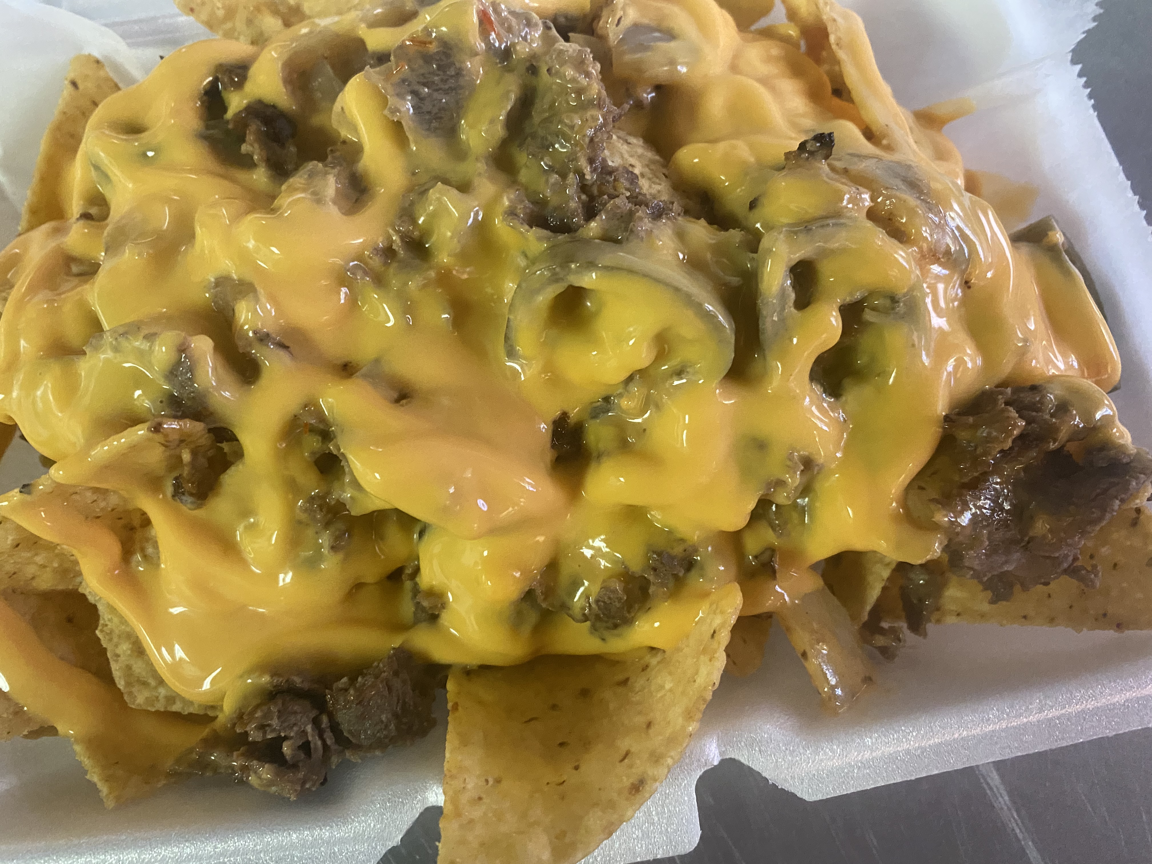 Order Loaded nachos with chicken  food online from Flava Wingz Spot store, Irvington on bringmethat.com