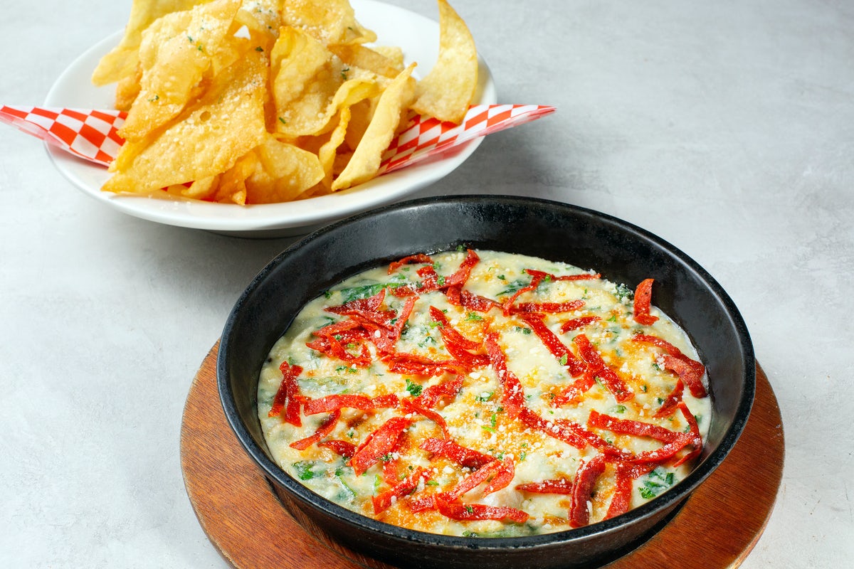Order SPINACH ARTICHOKE DIP food online from Johnny Carino store, Fairfield on bringmethat.com
