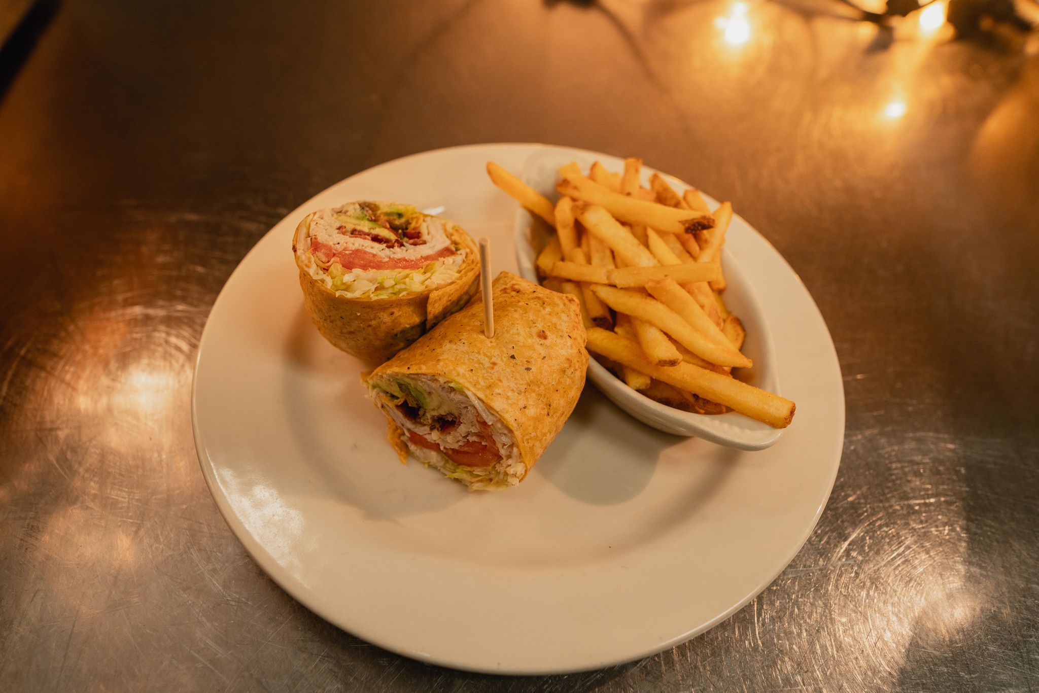 Order Turkey, Avocado and Bacon Wrap  food online from Jaker Bar & Grill store, Pocatello on bringmethat.com
