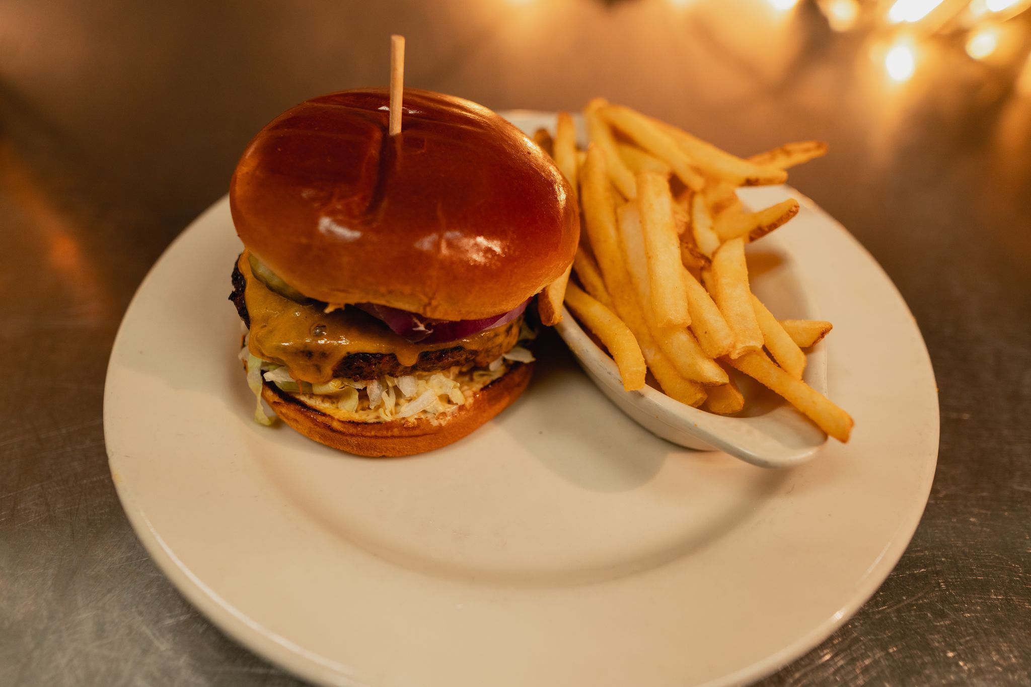 Order Cheeseburger (6oz) food online from Jaker Bar & Grill store, Pocatello on bringmethat.com