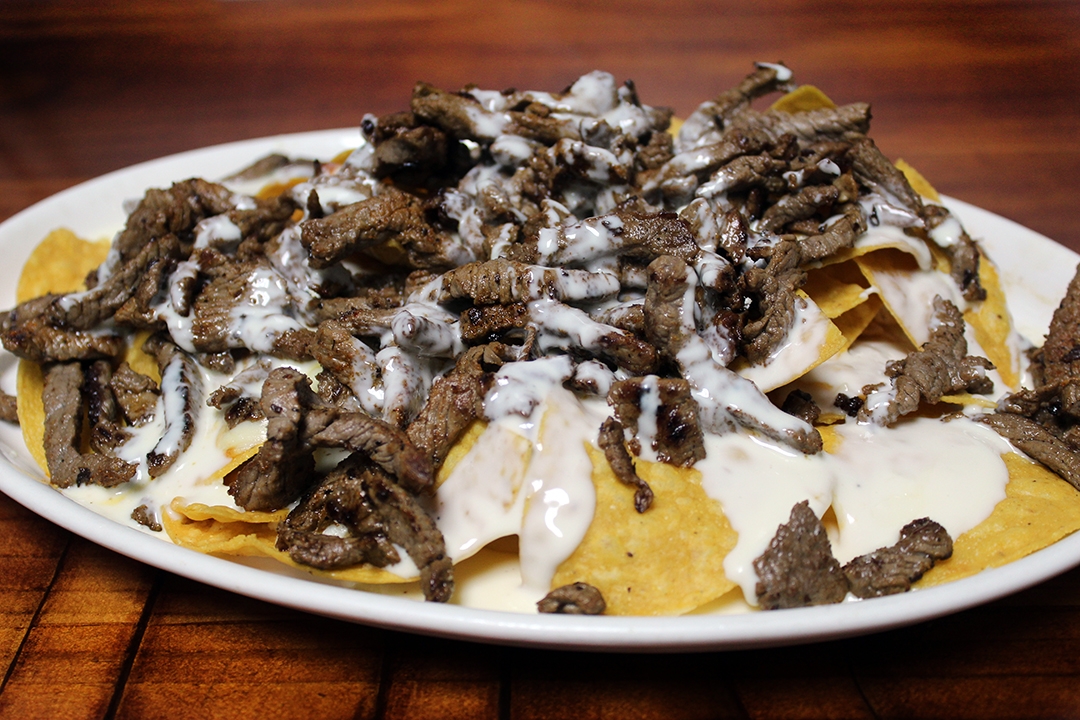 Order Grilled Beef Nachos food online from Tito Mexican Restaurant store, Spring Hill on bringmethat.com