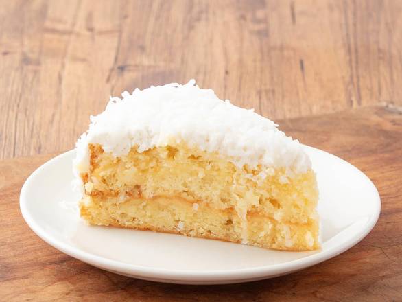 Order Coconut Cream Cake food online from Eggcellence Cafe store, Houston on bringmethat.com