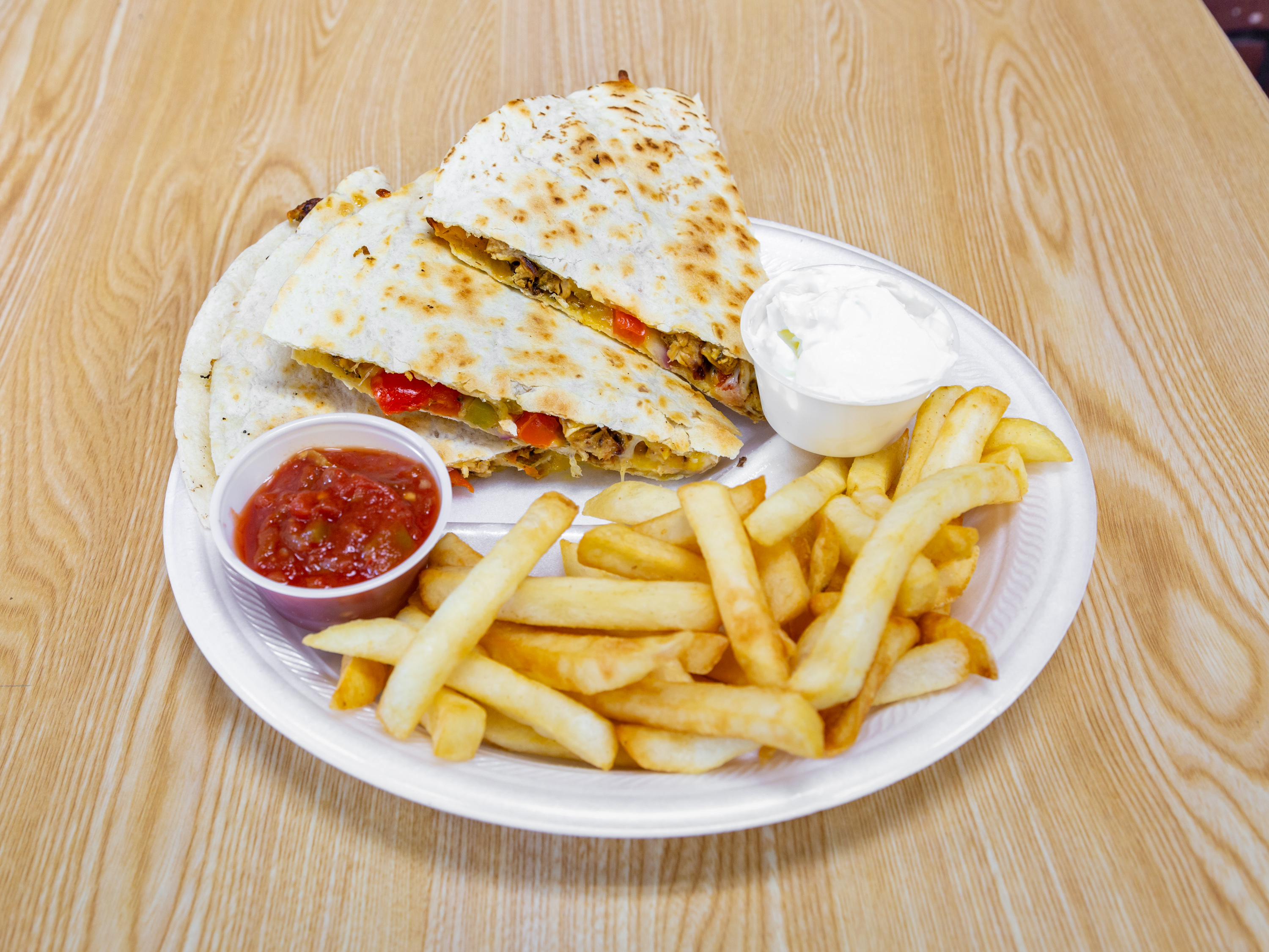 Order Grilled Chicken Quesadilla Lunch Special food online from Bagel One store, East Brunswick on bringmethat.com