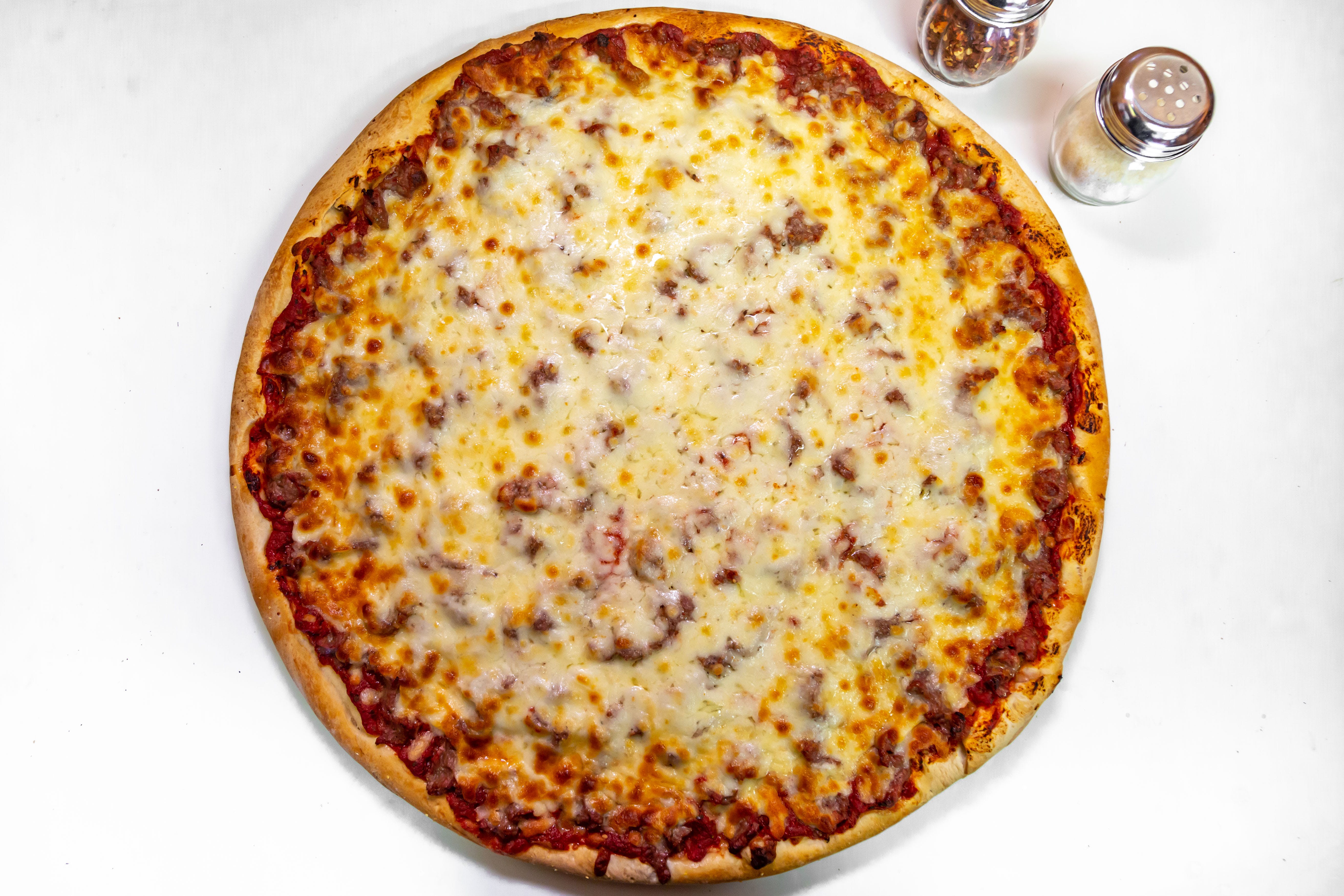 Order Slice of Sausage Pizza - Slice food online from Benny's Pizza store, Chicago on bringmethat.com