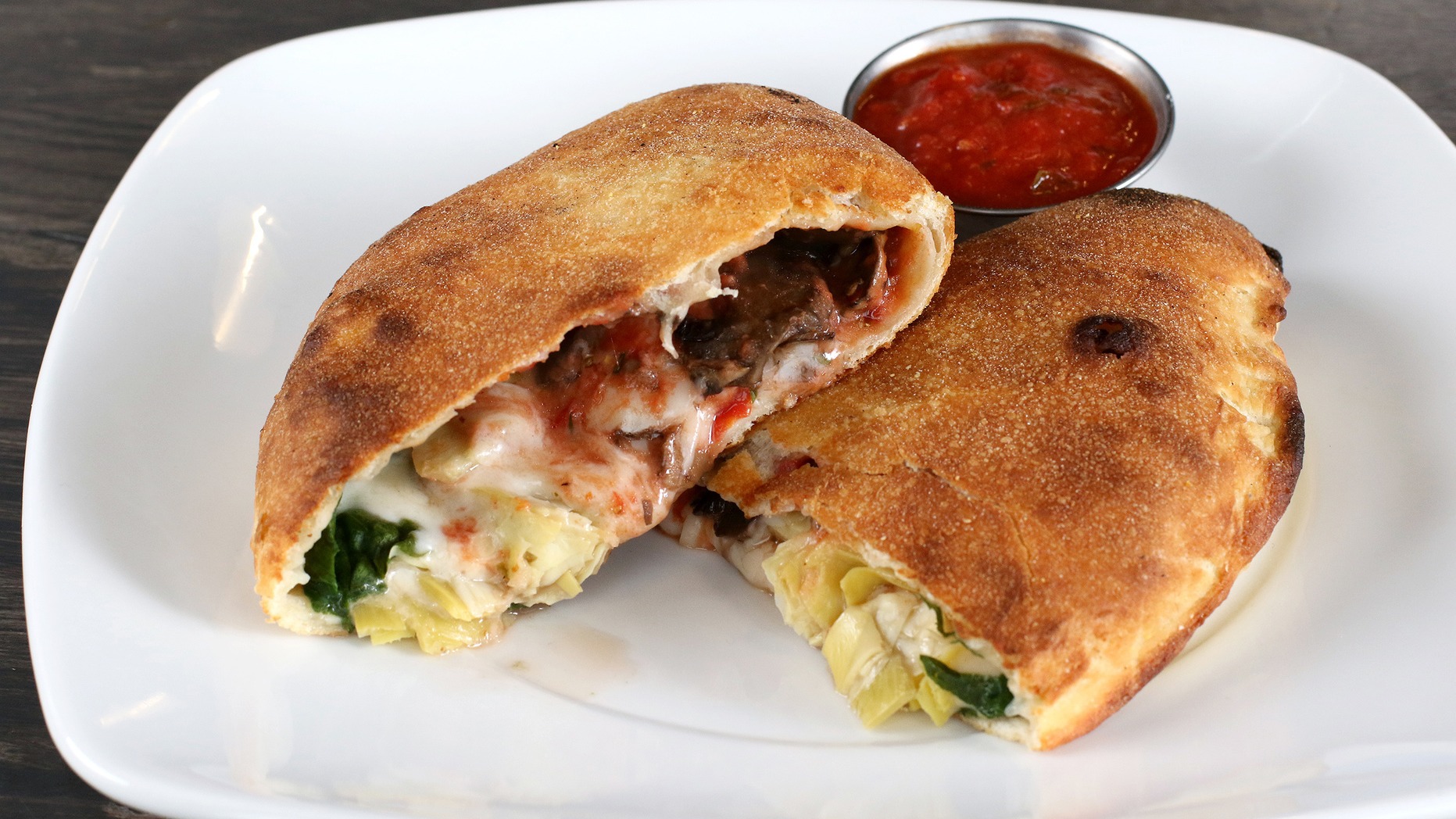 Order Roasted Veggie Calzone food online from zpizza Tap Room store, La Jolla on bringmethat.com