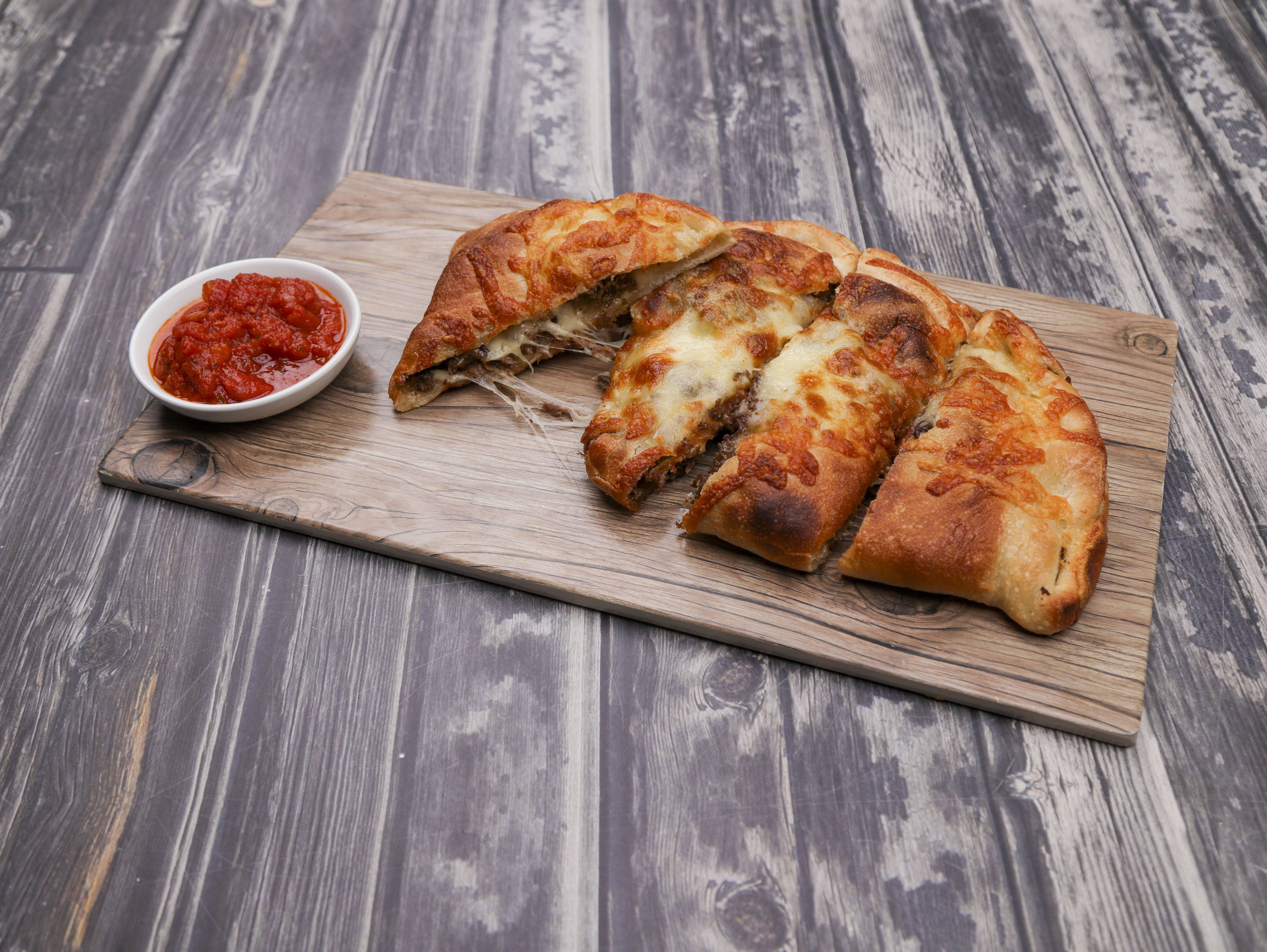 Order Cheesesteak Calzone food online from Primo Pizza & Roast Beef store, Lynn on bringmethat.com