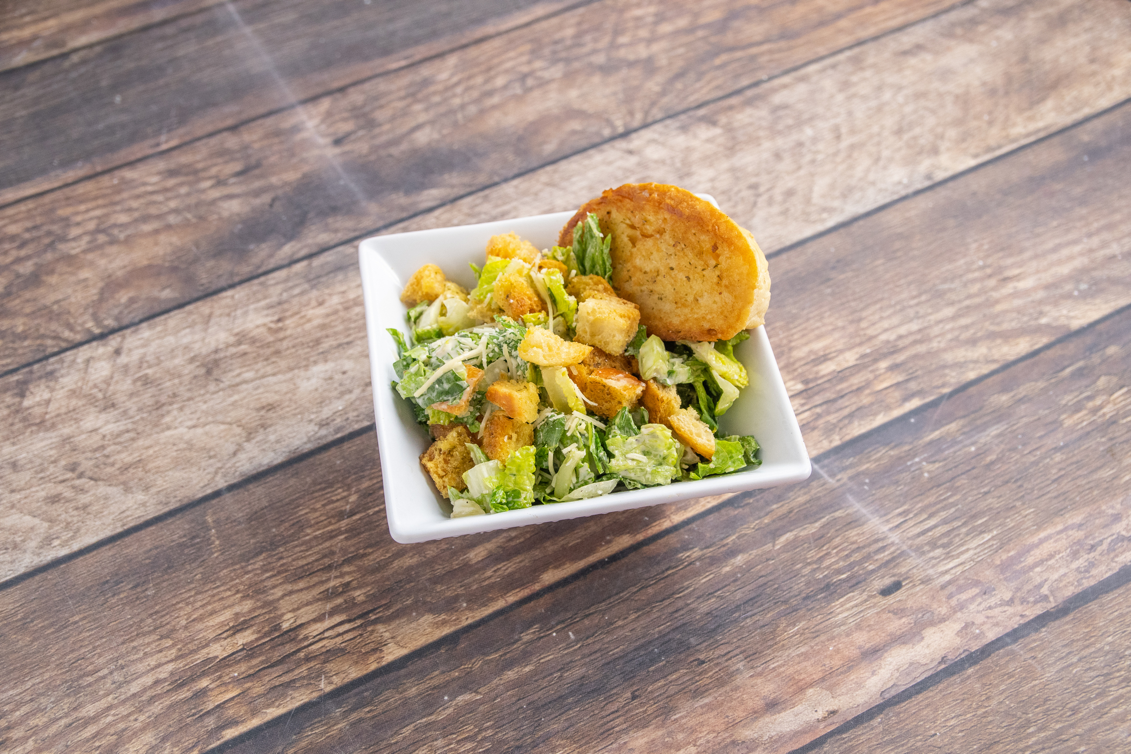 Order Caesar Salad food online from Fuddruckers Restaurant store, Concord on bringmethat.com