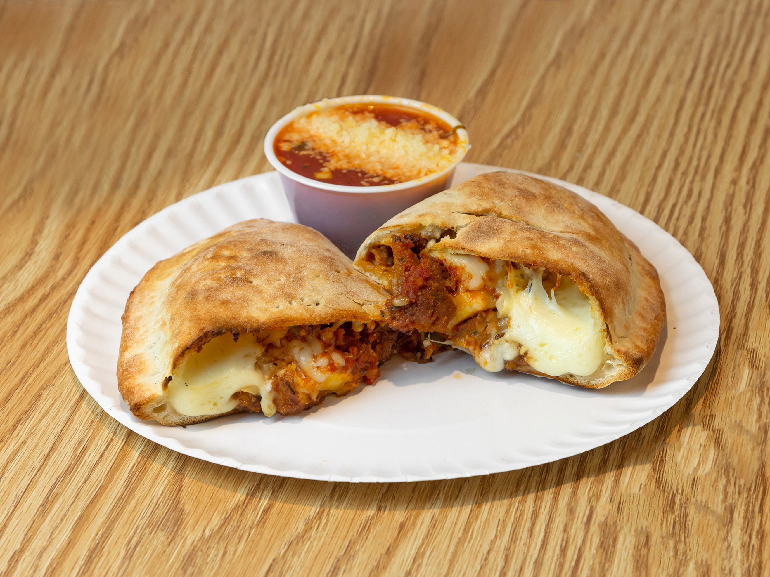 Order Sausage Calzone food online from Christian Pizza store, Charlottesville on bringmethat.com