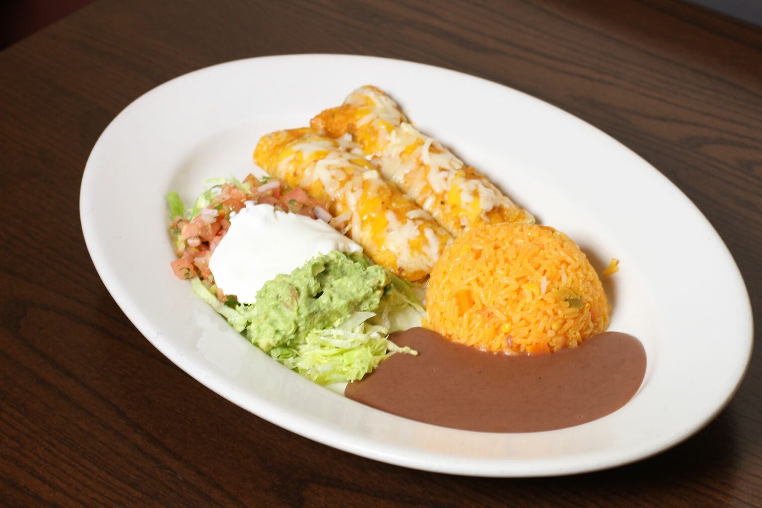 Order 2 Enchiladas de Frijoles  food online from El Rinconcito Cafe store, Washington on bringmethat.com